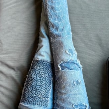 Jeans mended with sashiko stitching methods. Fashion, Embroider, Fiber Arts, DIY, Upc, cling, and Textile Design project by Adrienne R - 01.21.2024