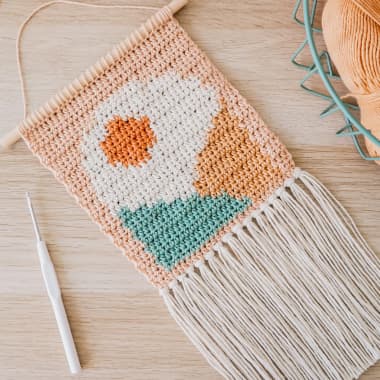 Descarga gratis un patrón de intarsia crochet para crear un tapiz