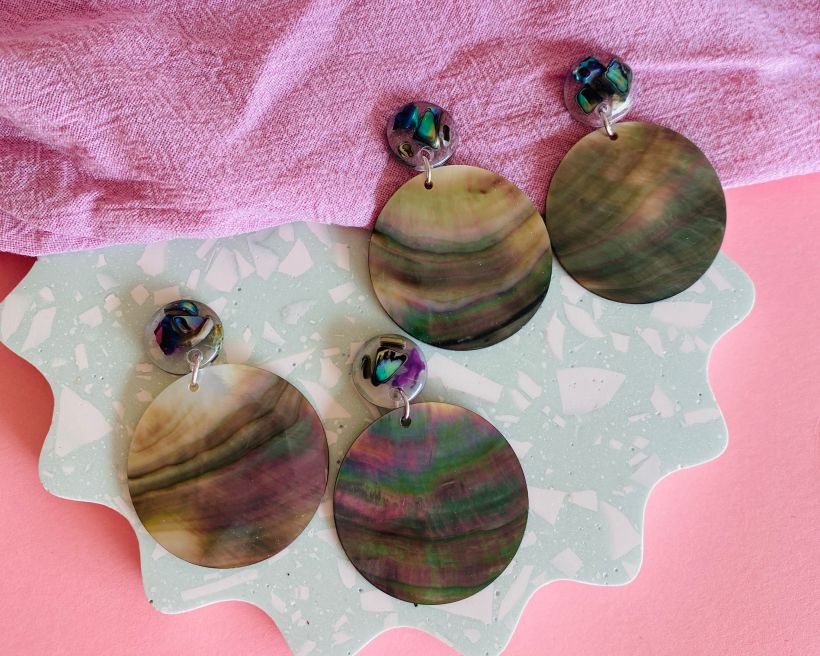 Resin studs filled with crushed abalone with large abalone disks.