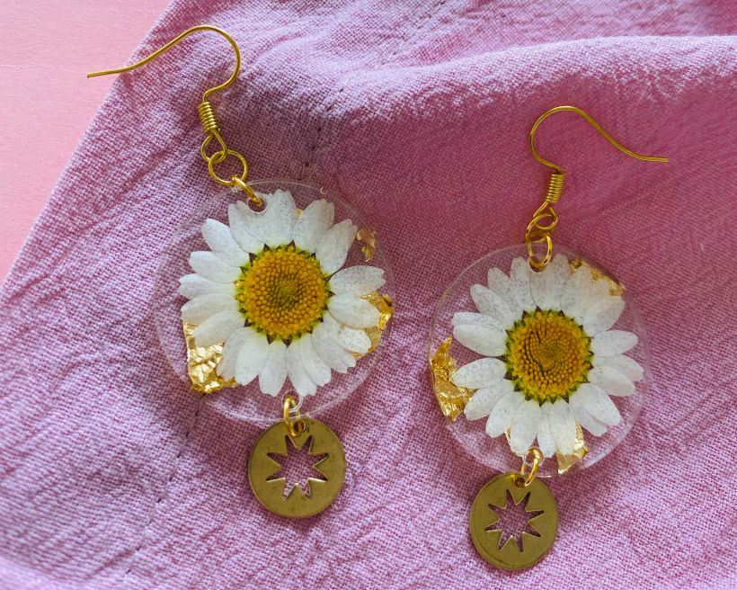 Large daisy earrings with gold leaf and brass shapes.