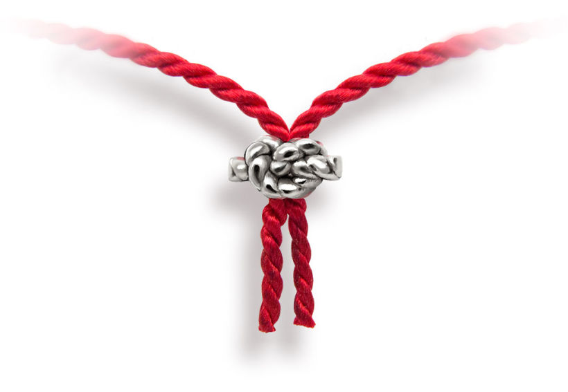 Red cord made of .925 silver knot bead and silk cord.