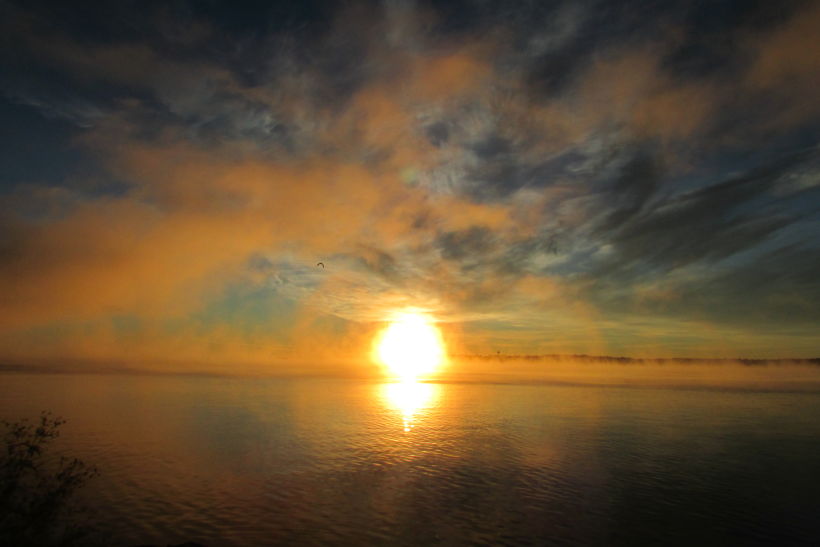 Sunrise behind a cloud of fog on Blockhouse Island