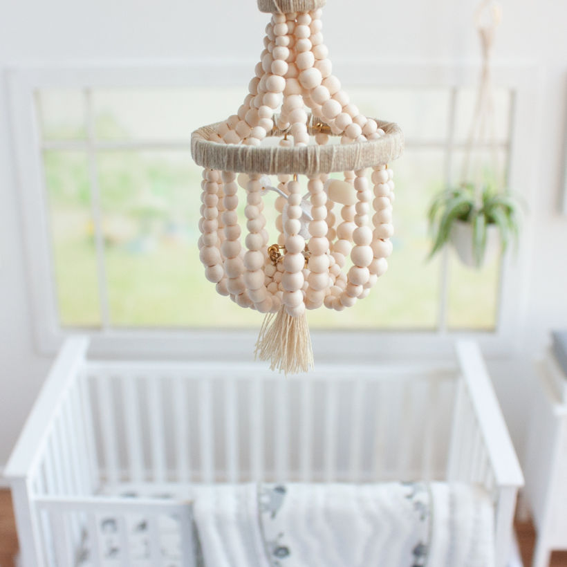 A tiny version of their wooden beaded chandelier.