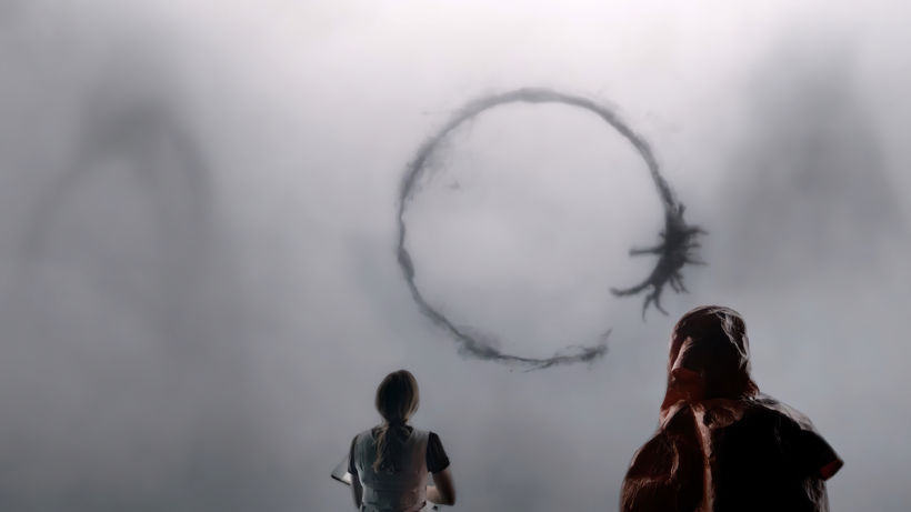 Aliens and humans attempt to communicate in this still from "Arrival" (2016).