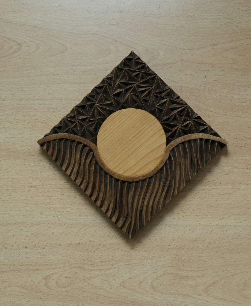 The finished piece. Carved by hand using gouges to create 3 levels. I then used a knife to carve the remaining patterns.