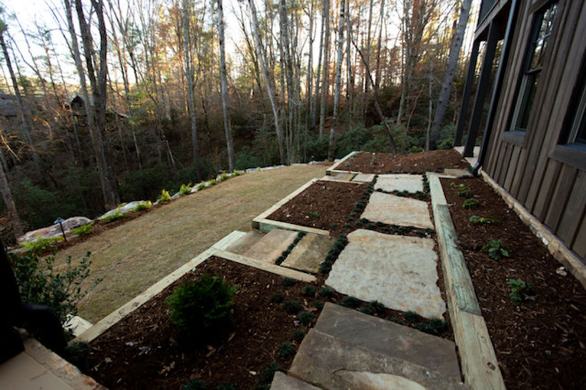 The goal was to get the clients safely from the walk-out basement to the lake: so we created terraces, steps, and a path. 