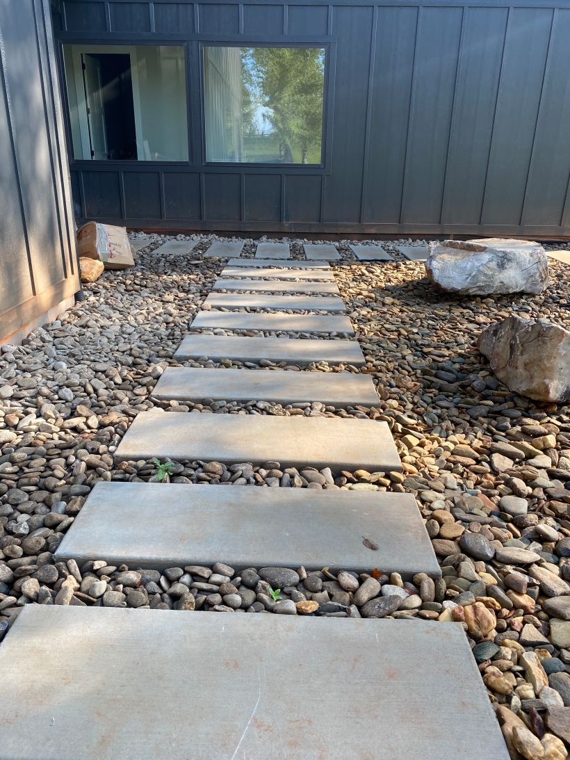 I love these poured-in-place concrete steps with river rock & boulders