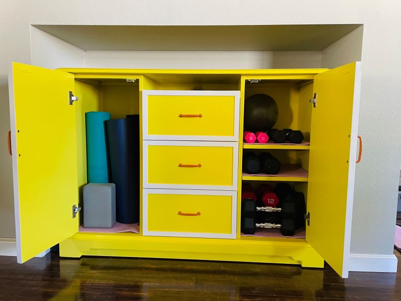 This little dresser holds all of my home workout equipment and really brightens up my day.