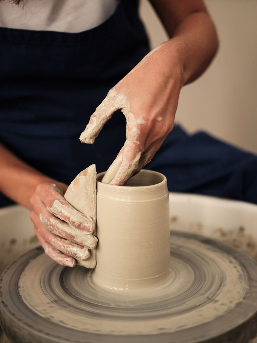 Clara at work at her pottery wheel
