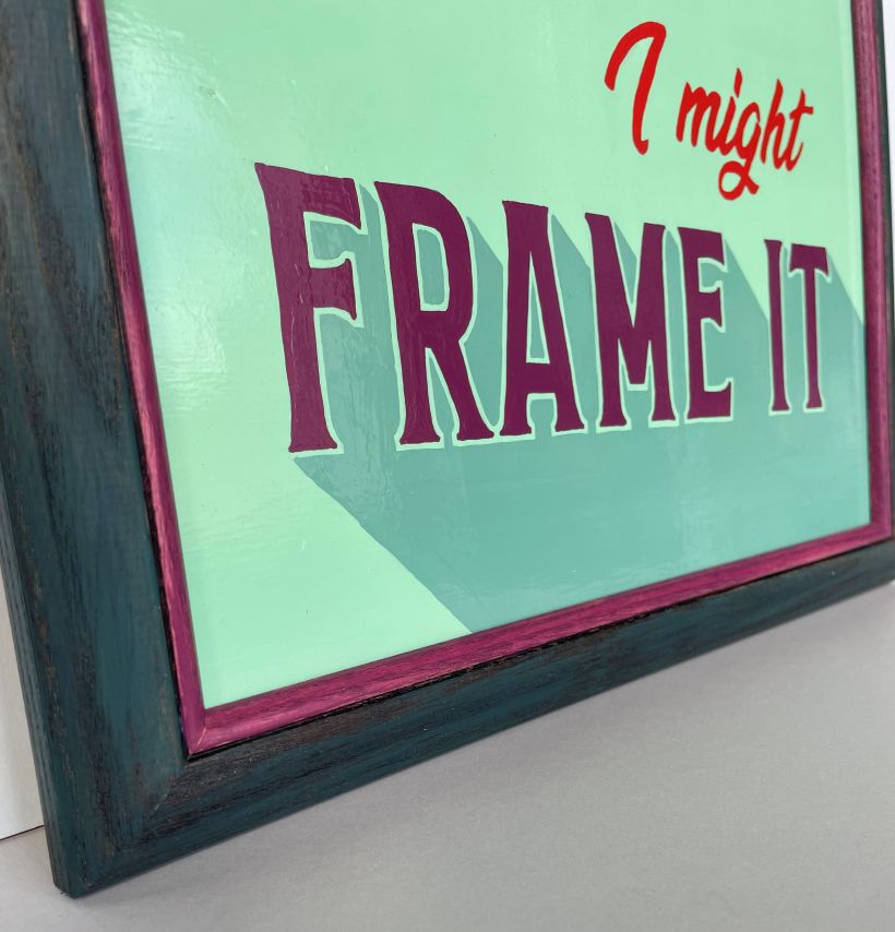 Close up of frame: Ash wood with a dark stain then a teal wash, and leftover enamel paint on the sight edge.