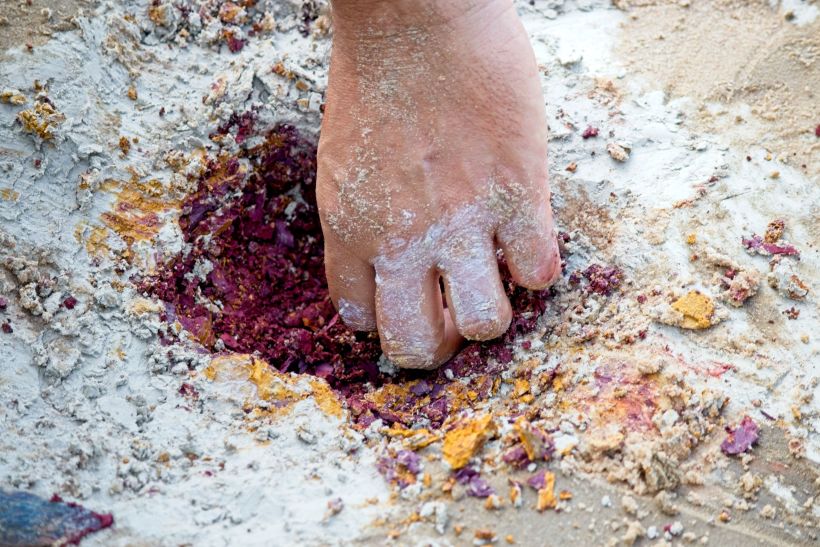 harvesting pigments on the Amazon river banks
