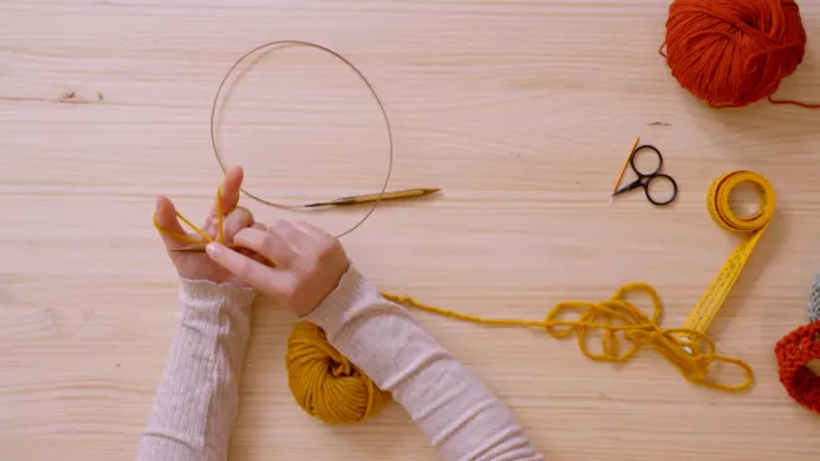 Use your hands to form a "V" shape with the yarn before you start forming the stitches.