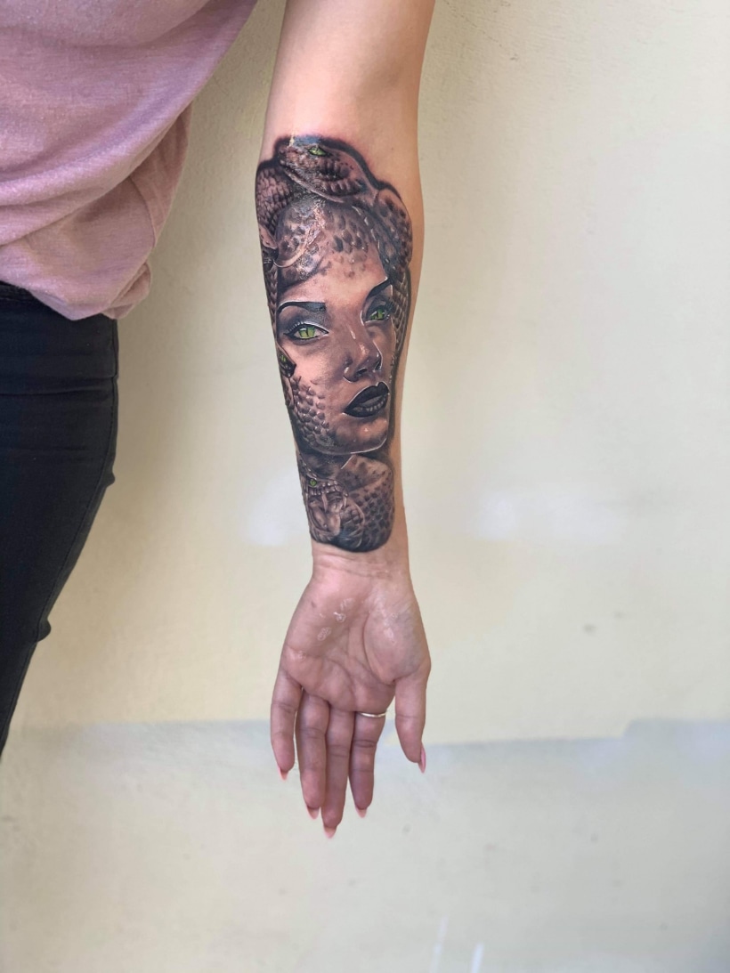 Realistic Medusa portrait tattoo on the thigh
