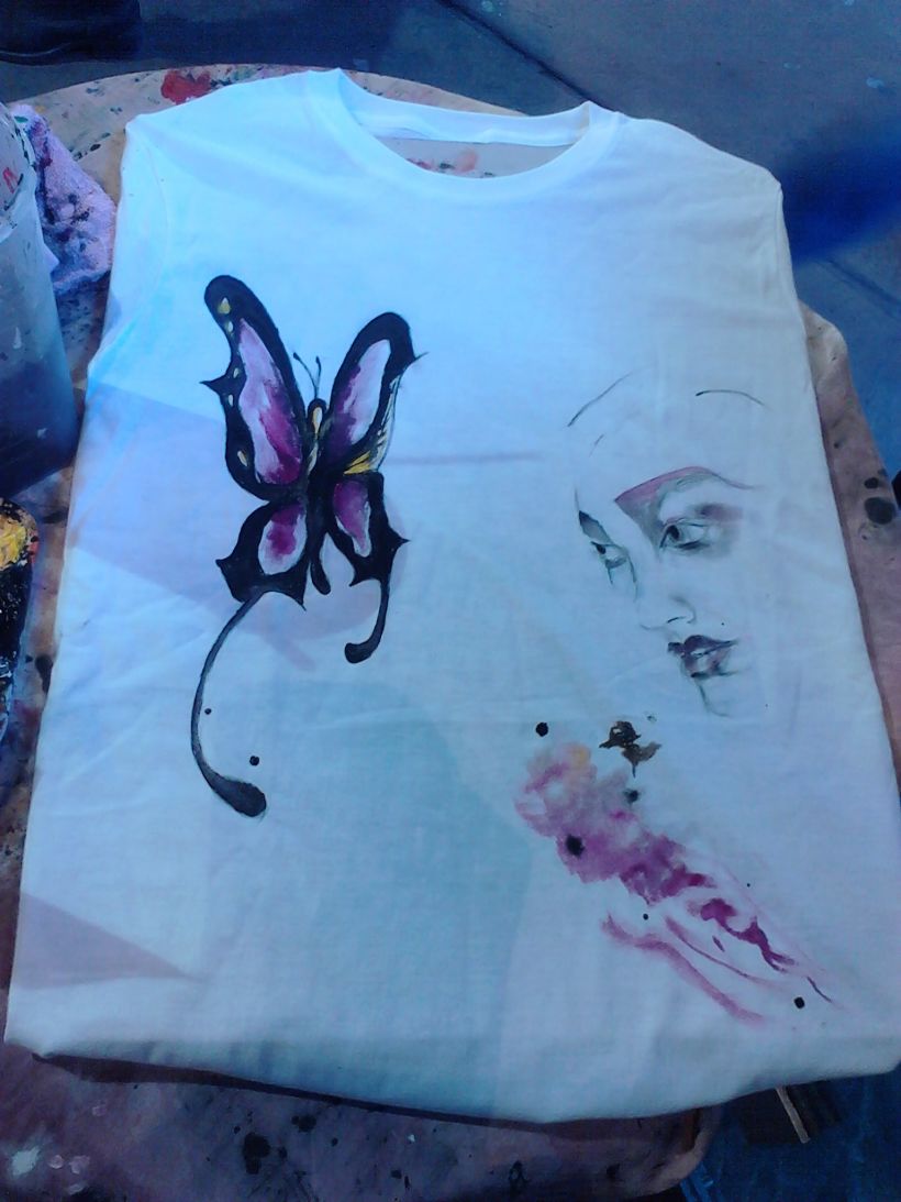 Hand made paintings. T-Shirts and also recycle glass in Camden Market, London 1
