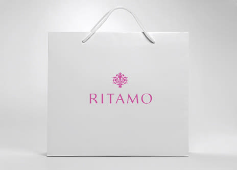 Logotipo para Ritamo, una boutique ubicada en la milla de oro madrileña donde se venden artículos multimarca de alta calidad como bolsos, bisutería, fulares, sombreros, gafas, relojes, etc... -1
