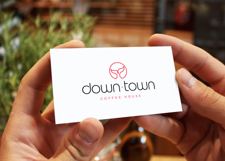 DownTown es una cafetería ubicada en la localidad argentina de Puerto Madryn. El isotipo se basa en la forma de la cola de una ballena ya que la localidad es famosa por su turismo de avistamiento de ballenas. 0
