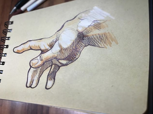 Hand, sketchbook.